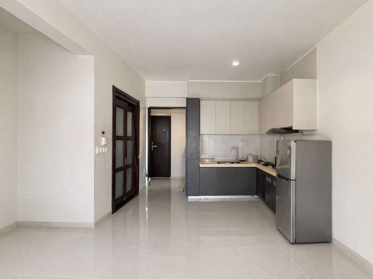 Open-plan living area and fitted kitchen