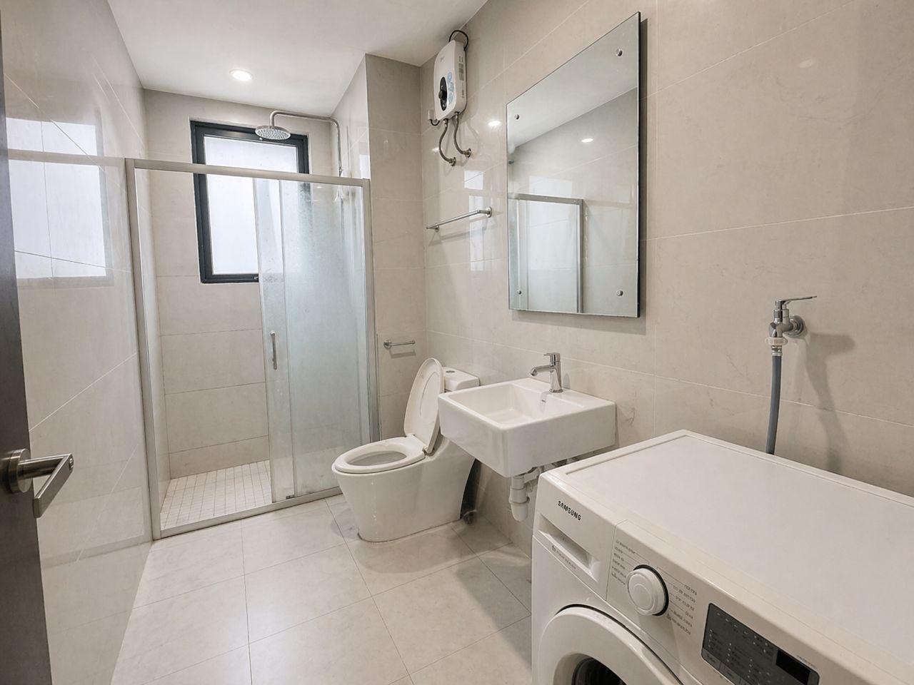 Bathroom with shower screen and washing machine